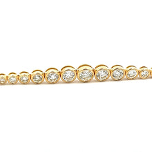 This easy to style bracelet features bezel-set round brilliant cut ...