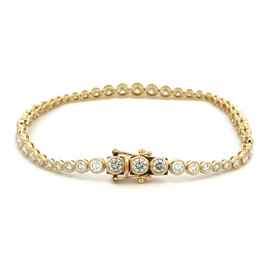 This easy to style bracelet features bezel-set round brilliant cut ...