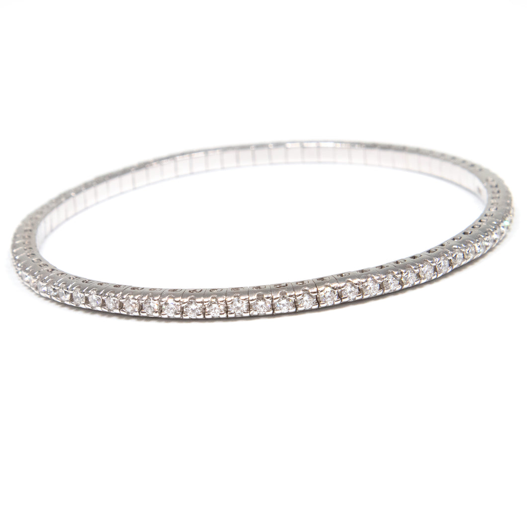 This tennis style stretch bracelet features round brilliant cut dia...