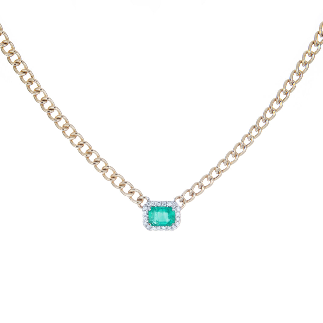 necklace features center emerald totaling .87ct and surround diamon...