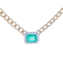 necklace features center emerald totaling .87ct and surround diamon...