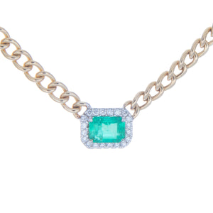 necklace features center emerald totaling .87ct and surround diamon...