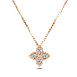 This 18k yellow gold necklace from Roberto Coin features round bril...