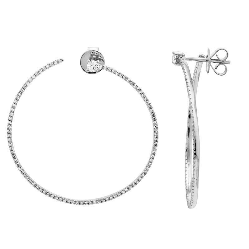 These hoop earrings feature pave set round brilliant cut diamonds t...