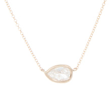 Dainty and easy to layer necklace features a pear shape diamond tot...