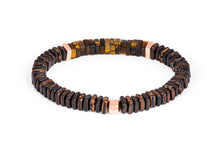 








Ebony and palm wood beads are accented by rose gold-colour...