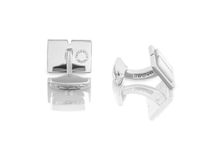 















 These cufflinks feature a white mother of pearl ce...