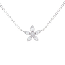 this mini pendant features diamonds arranged in flower shape totali...