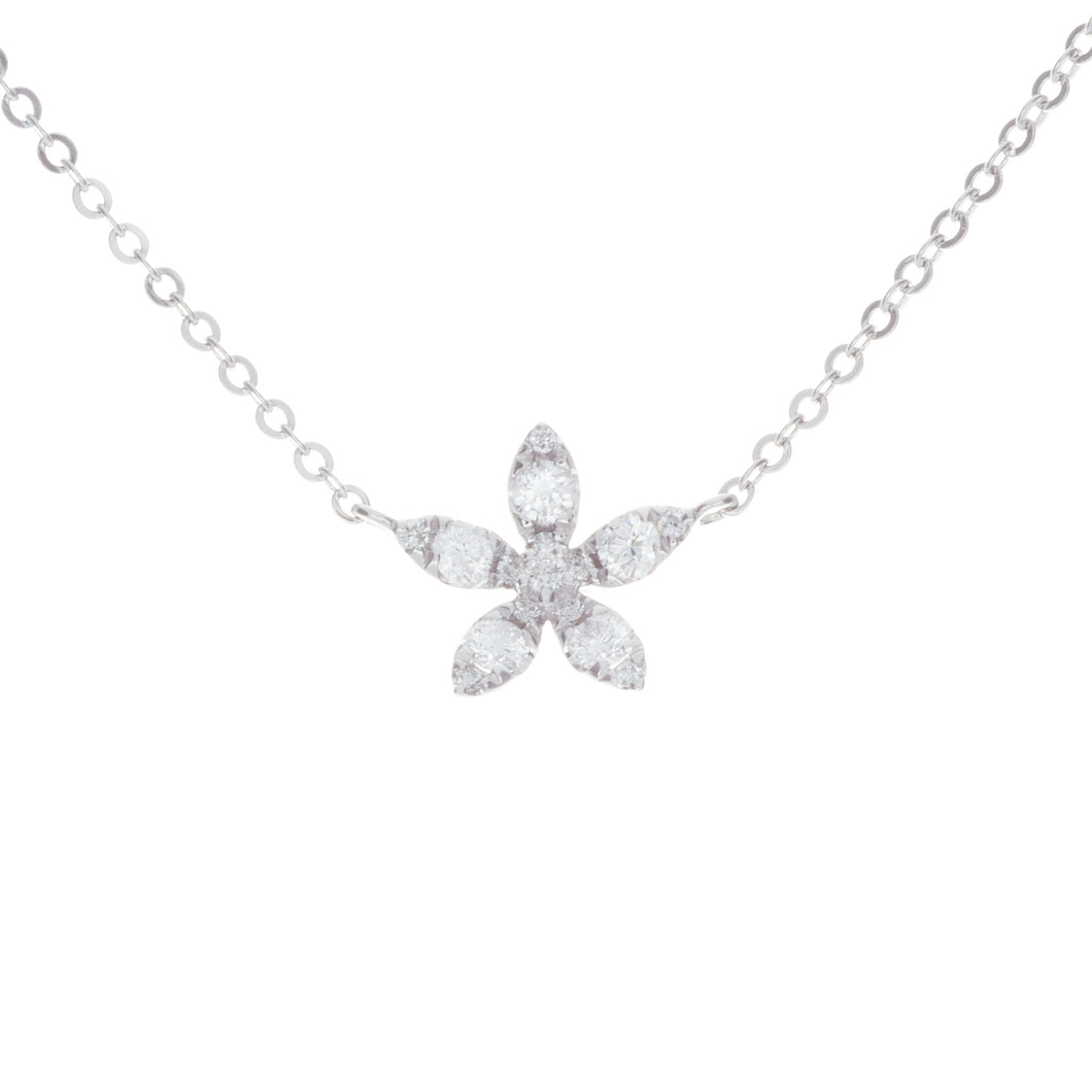 this mini pendant features diamonds arranged in flower shape totali...