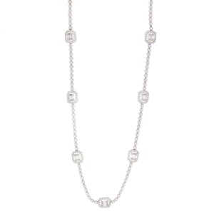 This necklace features 7 stations with round and baguette cut diamo...