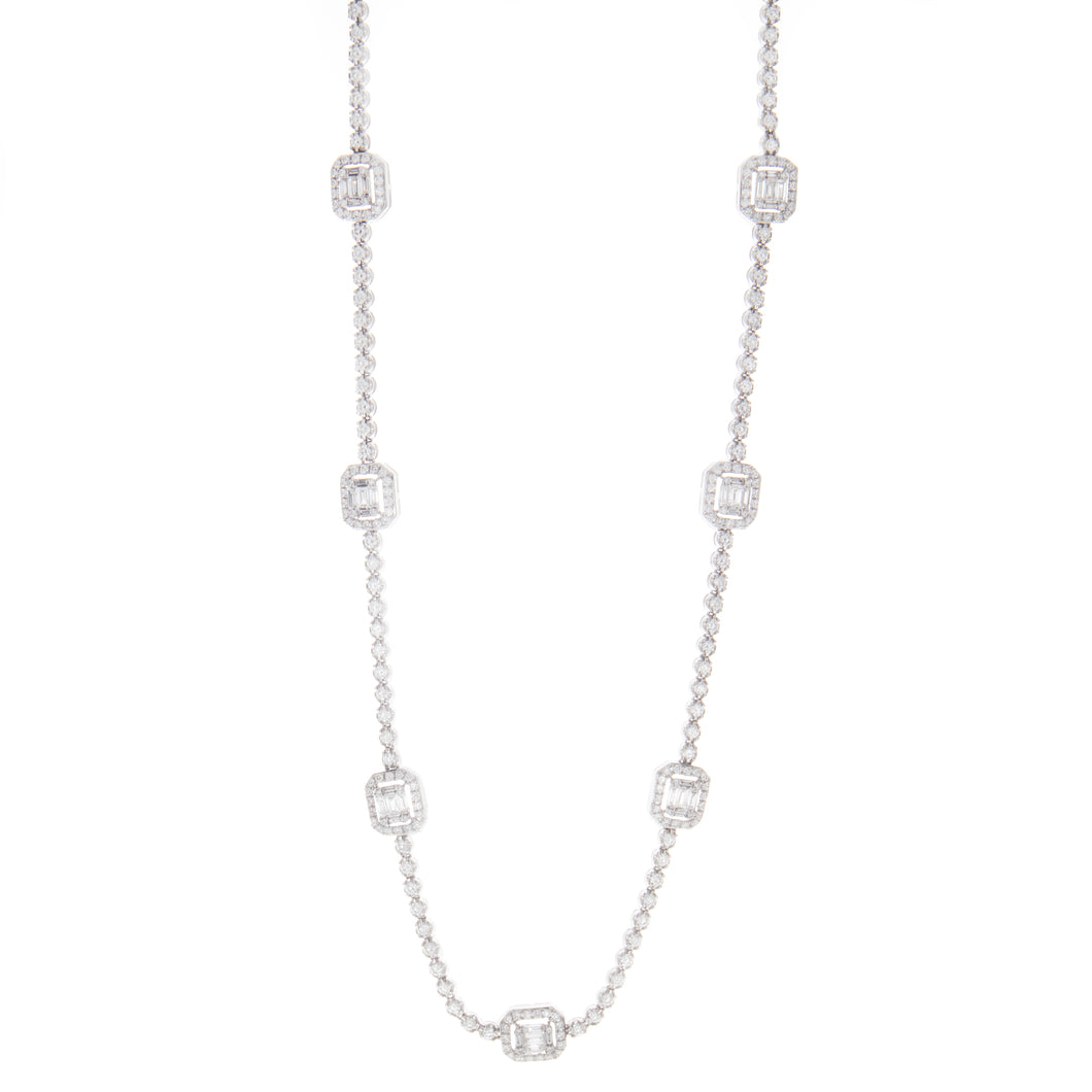 This necklace features 7 stations with round and baguette cut diamo...