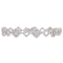 This stunning bracelet features 9 princess cut diamonds totaling 2....