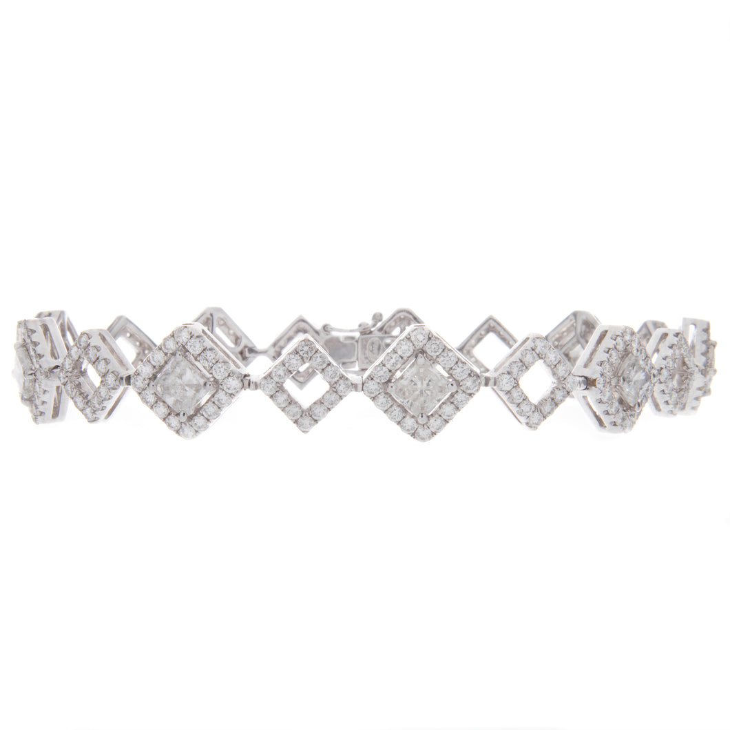 This stunning bracelet features 9 princess cut diamonds totaling 2....