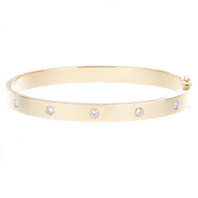 This chic bangle features 5 round brilliant cut diamonds totaling ....