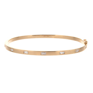 this classic bangle features 7 baguette cut diamonds totaling .45ct