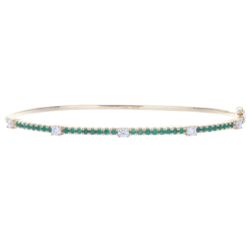 this colorful bangle features emeralds totaling .56ct and diamonds ...