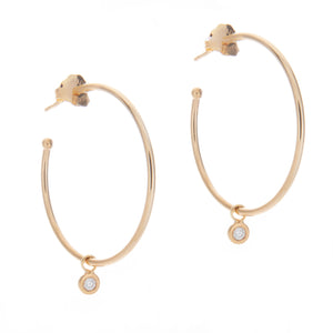 14k yellow gold hoops featuring bezel set diamond drops