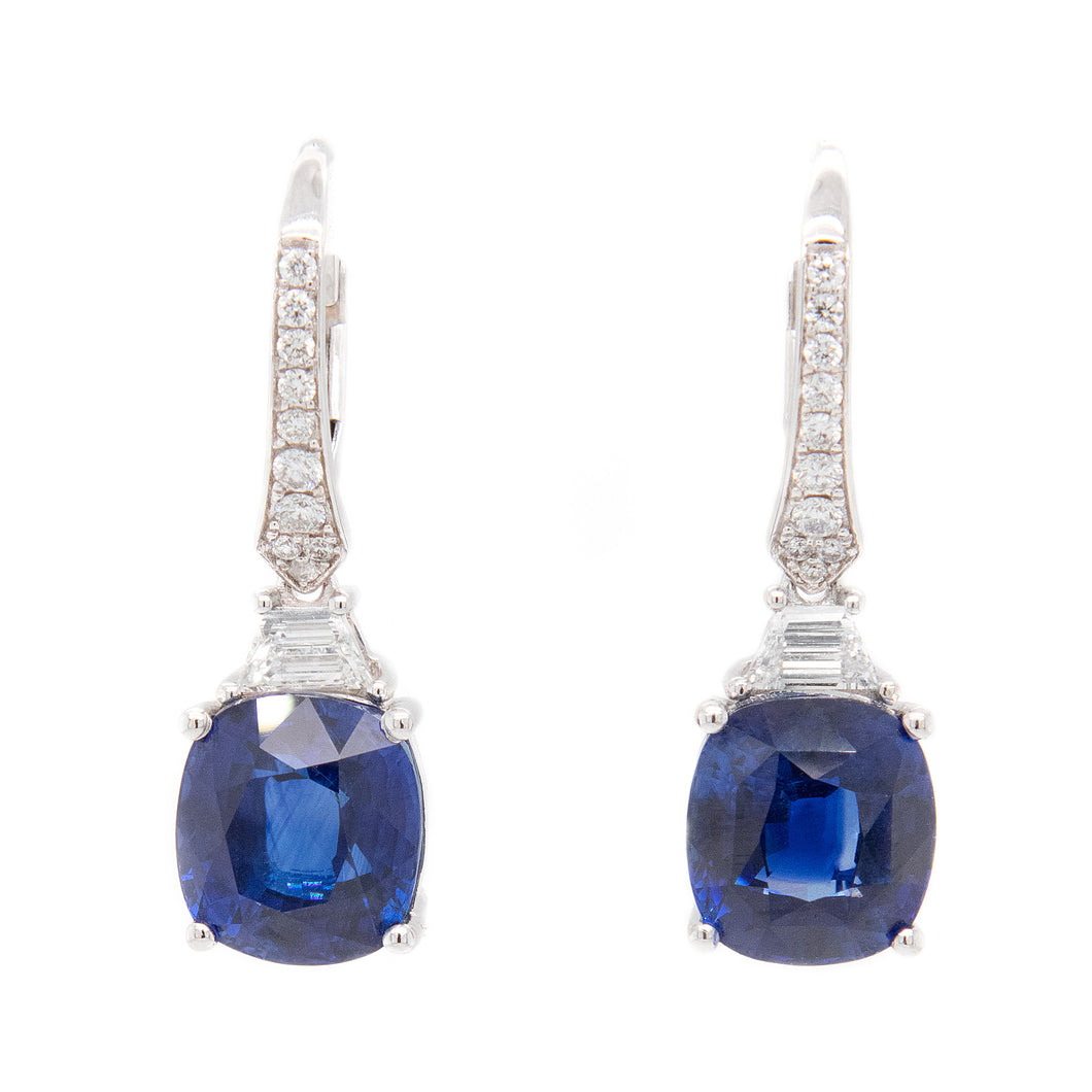 These drop earrings feature 2 trapezoid cut diamonds totaling .27ct...